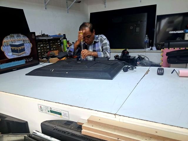 Repairing a television in the workshop
